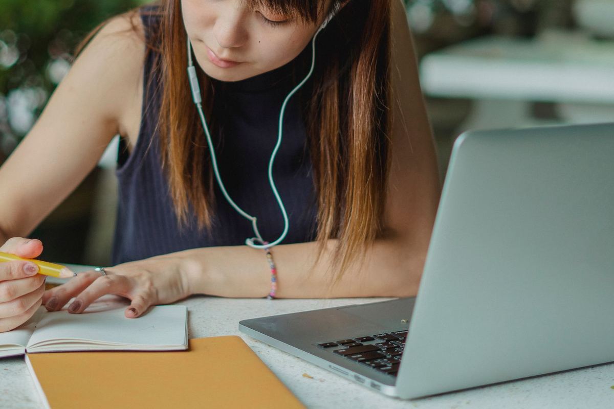 A new agent studying at a laptop
